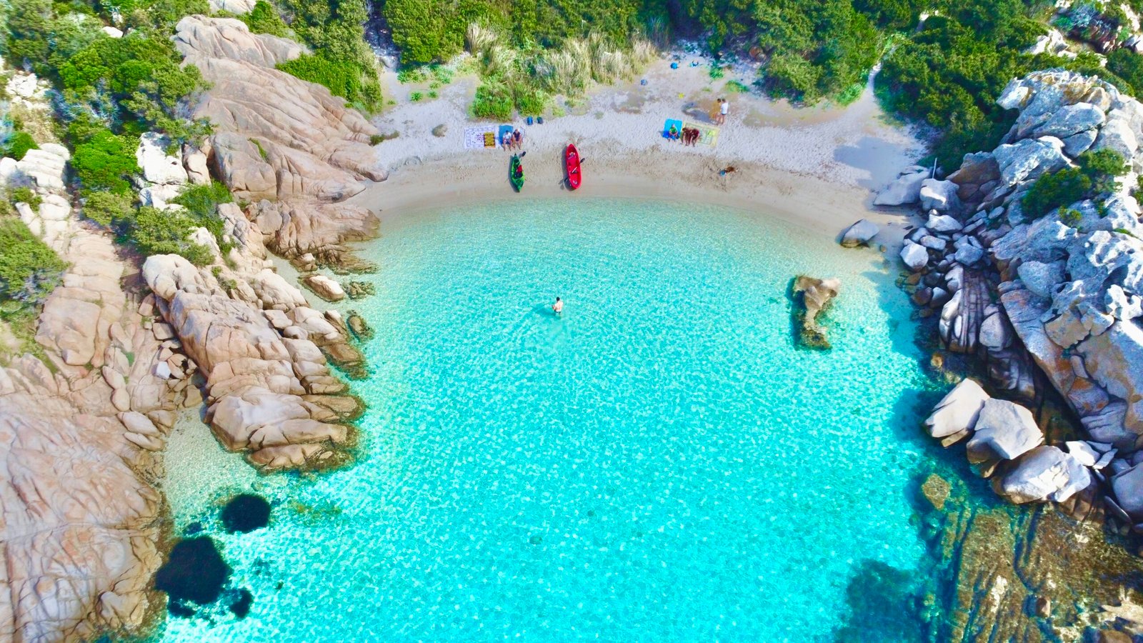 Crystal-clear sea of Olbia, Sardinia — north-eastern coast seen from drone